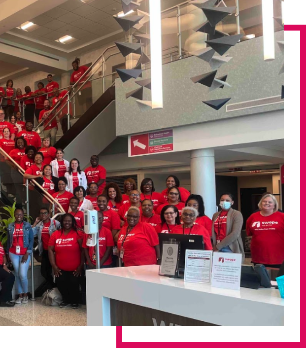 Swope health team in matching t-shits at Swope Health central