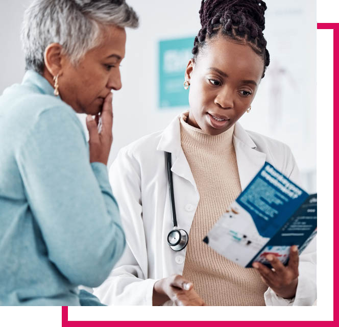 Doctor explaining pamphlet to patient